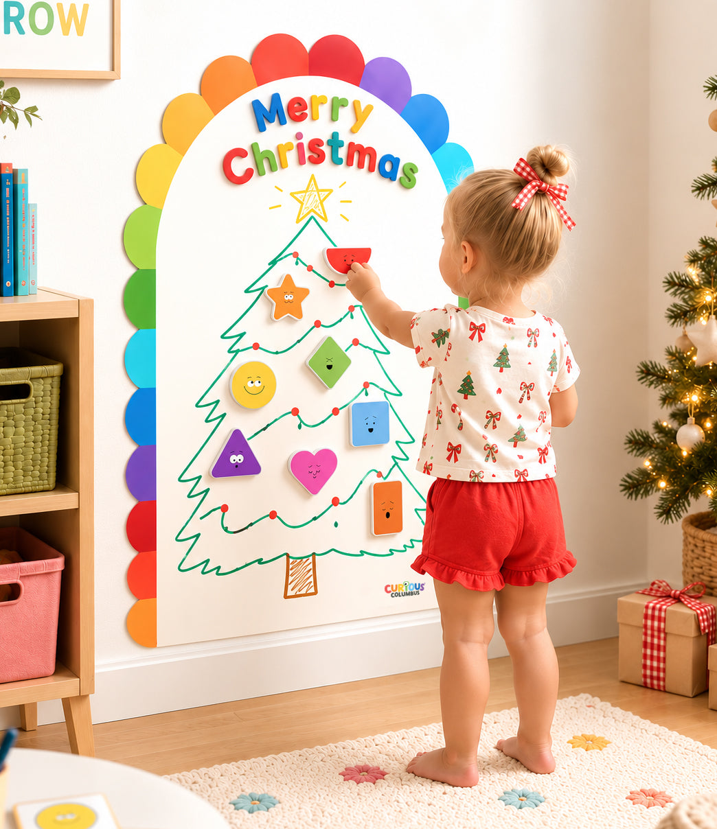 christmas shape matching activity set up for toddler on magnetic wall decal